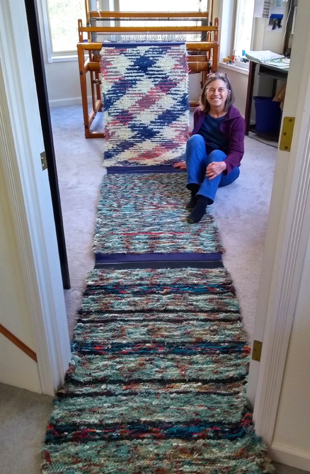 Photo of me in my weaving studio